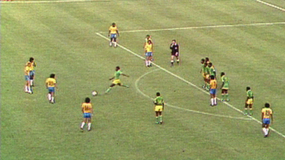 Zaire's Mwepu Ilunga kicks the ball away against Brazil