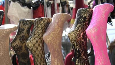 Coloured stockings on mannequin legs