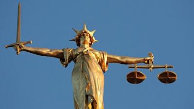 The figure of Lady Justice, at the top of the dome of the Central Criminal Court,