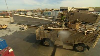 Cleaning a truck in Afghanistan