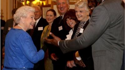 The Queen meets her guests at Buckingham Palace