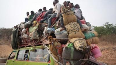 A vehicle loaded with people and their possessions fleeing CAR to Cameroon