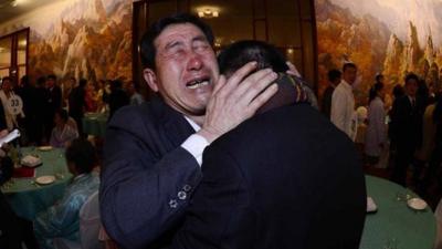 South Korean Park Yang-gon, 53, and his North Korean brother Park Yang-su, cry during their family reunion at the Mount Kumgang resort in North Korea