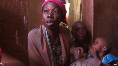 Dakar tenant, Awa Diallo with two children