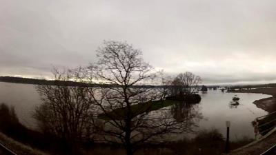 View of flooded fields from train window