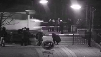 CCTV of train and pedestrians