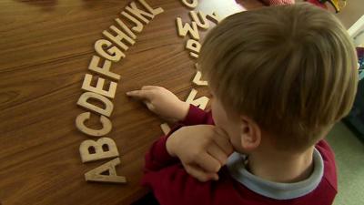 Child with alphabet letters