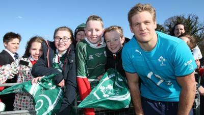 Chris Henry poses with fans at the Ireland training camp at New Forge Lane in Belfast