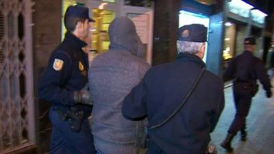 Spanish police arresting a suspected member of a boiler room set-up