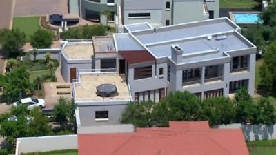 This file aerial image taken from video shows the home of Olympic athlete Oscar Pistorius in a gated housing complex in Pretoria, South Africa