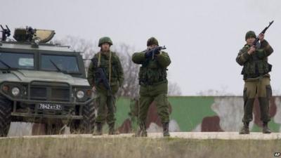 Russian soldiers firing warning shots at the Belbek air base