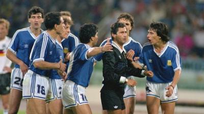 Argentina complain to referee Edgardo Codesal Mendez during the 1990 World Cup final