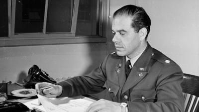 Frank Capra at his desk in the war department