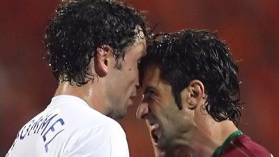 Netherlands's Mark van Bommel and Portugal's Luis Figo clash during the 2006 World cup