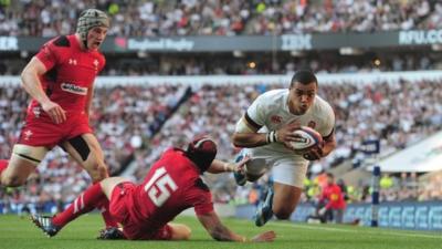 England's Luther Burrell scores a try against Wales