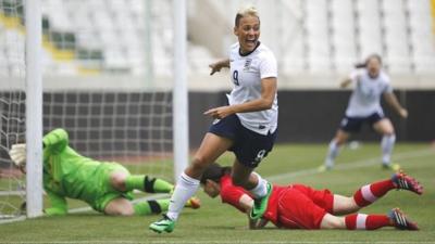 England's Lianne Sanderson celebrates after scoring against Canada