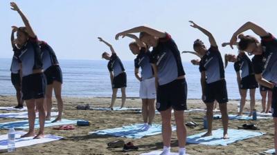 England women's football team do yoga on the beach in Cyprus