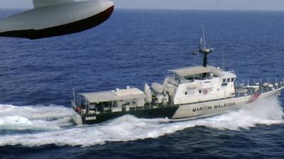 A patrol vessel of Malaysian Maritime Enforcement Agency searches for the missing Malaysia Airlines plane