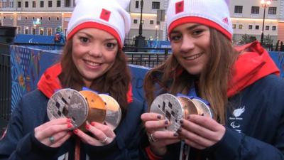 British skier Jade Etherington and guide Caroline Powell have won their third medal of the Winter Paralympics with silver in the visually impaired slalom.