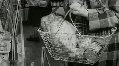 archive film of woman shopping