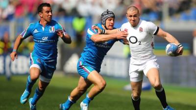 Mike Brown powers his way through to score for England against Italy