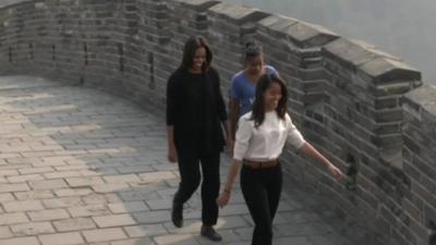 The Obamas walking along the Great Wall of China