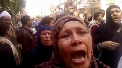 Relatives react after an Egyptian court sentences to death 528 supporters of ousted Islamist President Mohammed Morsi in connection to an attack on a police station that killed a senior police officer in Minya, 24 March 2014