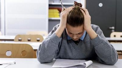 Student working at classroom desk