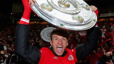 Bayern Munich's Thomas Mueller celebrates Bundesliga title