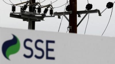 SSE sign in front of pylons