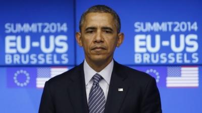 U.S. President Barack Obama looks on as he takes part in a EU-US summit in Brussels March 26, 2014