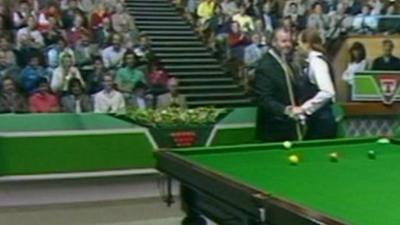 Alex Higgins shakes referee Len Ganley's hand at the Guild Hall