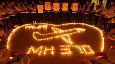 Students pray for missing plane passengers