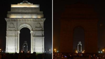 This combination picture of two photographs show the landmark India Gate monument before (L) and after (R) the lights were turned off to mark Earth Hour in New Delhi