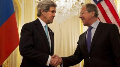 US Secretary of State John Kerry (L) shakes hands with Russian Foreign Minister Sergey Lavrov (R)