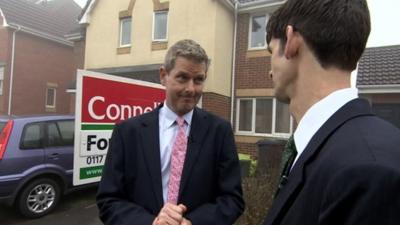 BBC West Business correspondent Dave Harvey (l) outside a home for sale