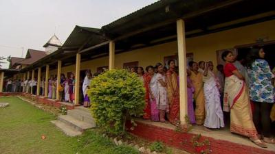 Voters in Assam queuing outside polling station