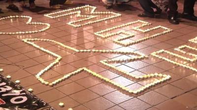 Candles form the image of a plane in Kuala Lumpur