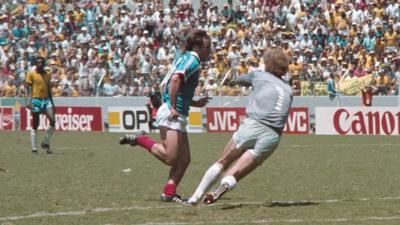 France's Bruno Bellone is fouled by Brazil's Carlos