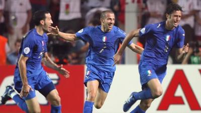 Italy celebrate after Fabio Grosso scores against Germany