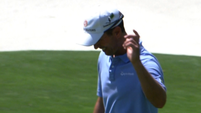 Canada's Mike Weir holes a chip from off the 11th green