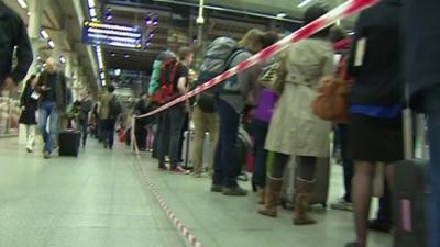 Eurostar passengers queue at St Pancras