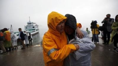 Relatives gather at the port in Jindo