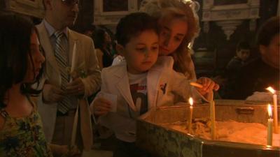 Family lighting candles