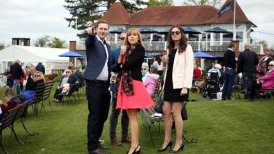 Public enjoy a drink in the sunshine during the All Weather Championships Finals Day at Lingfield Park Racecourse