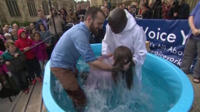 Dr John Sentamu conducting baptism