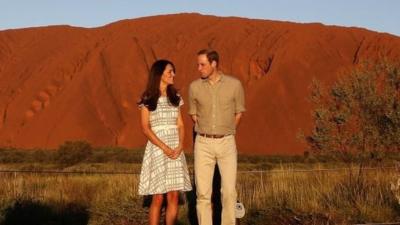 Prince William and his wife Catherine, Duchess of Cambridge, pose in front of Uluru