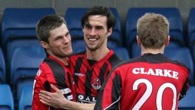 Crusaders players celebrate victory over Glenavon