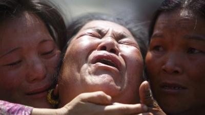 A family member a Sherpa climber is comforted by her relatives during a funeral rally of Nepali Sherpa climbers in Kathmandu April 21,