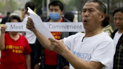 A relative of Chinese passengers onboard the Malaysia Airlines MH370 speaks to media